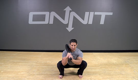 Steel Club Exercise: 2-Hand Shouldered Squat