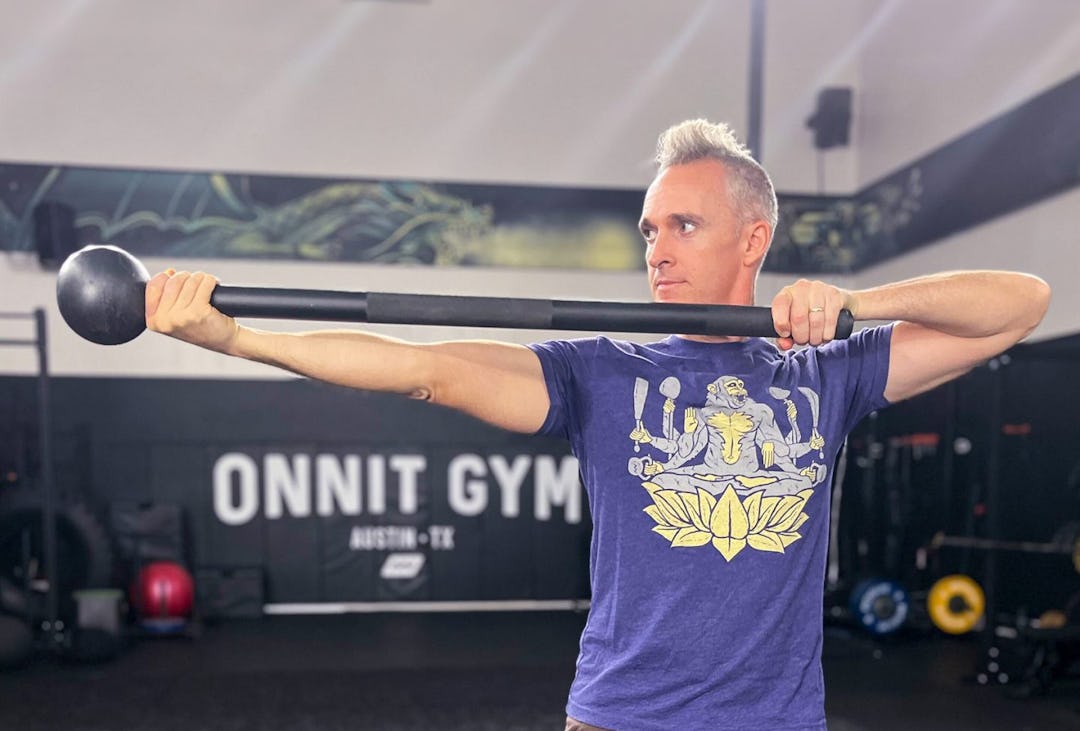 Shane Heins demonstrates the steel mace archer press.